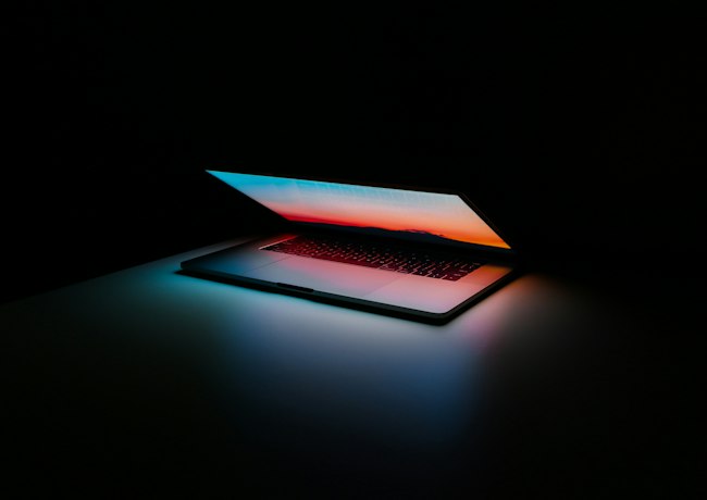 A laptop in a technology workspace